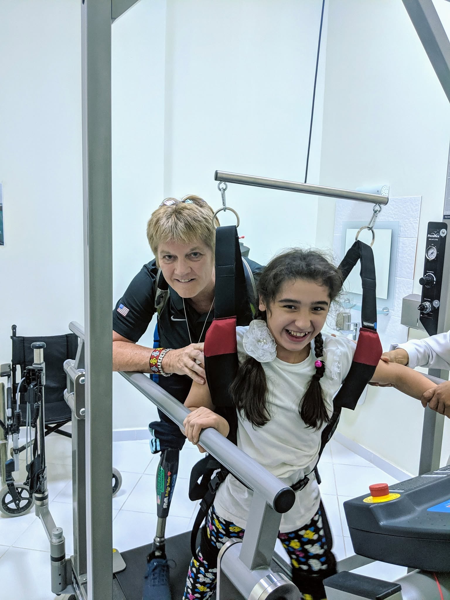 Robin helping a young girl take steps during ENVEST sports diplomacy training in Turkmenistan