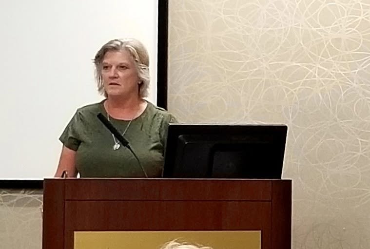 Robin Yoder speaking at a community event